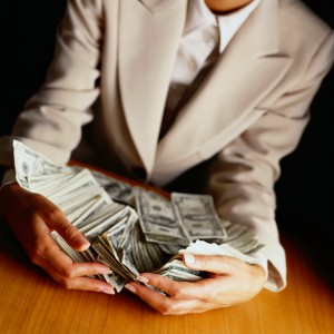 Businesswoman holding money 139212